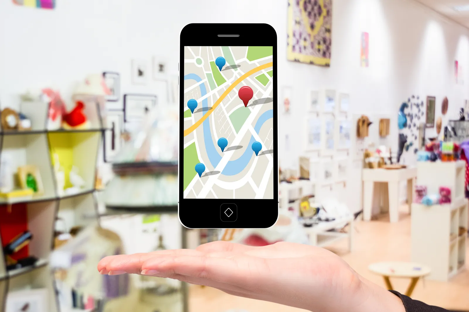 Móvil mostrando un mapa con la ubicación de un negocio, búsqueda local en Google